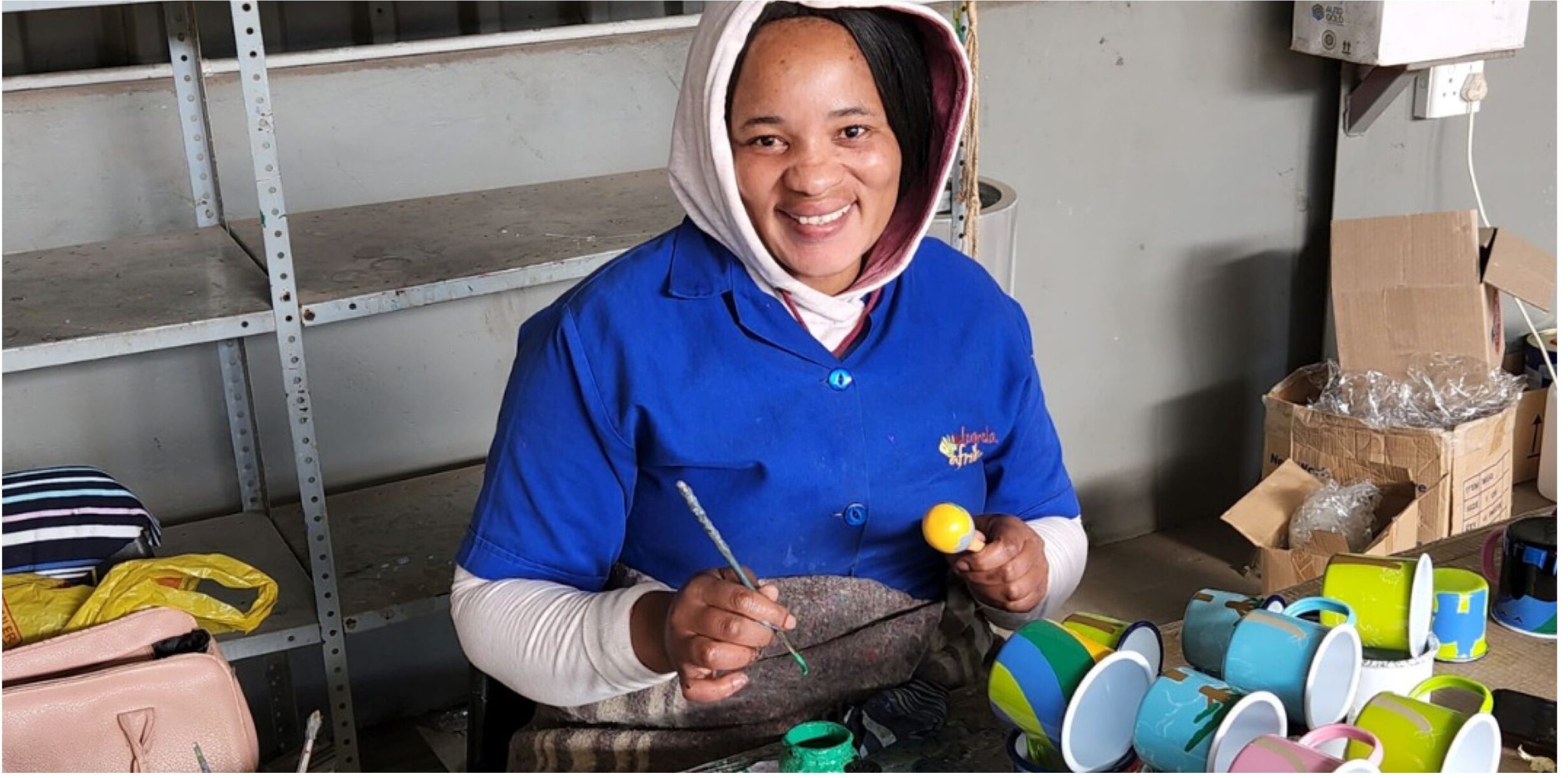 Smilende arbejder fra Lumela Africa